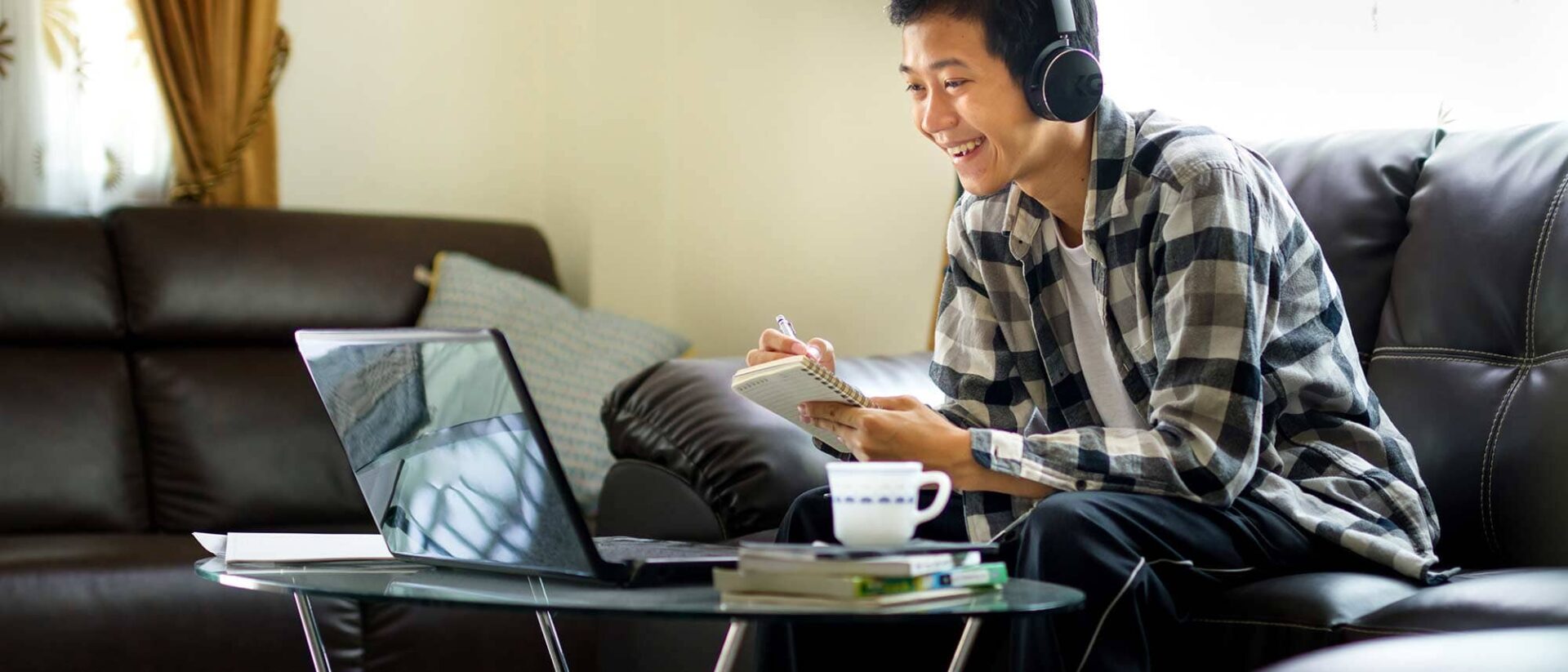 Student with headphones attending an online class image