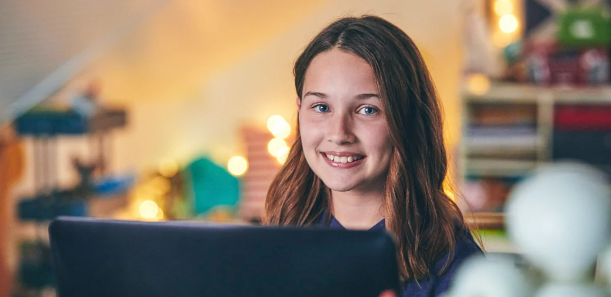 Student smiling at the camera