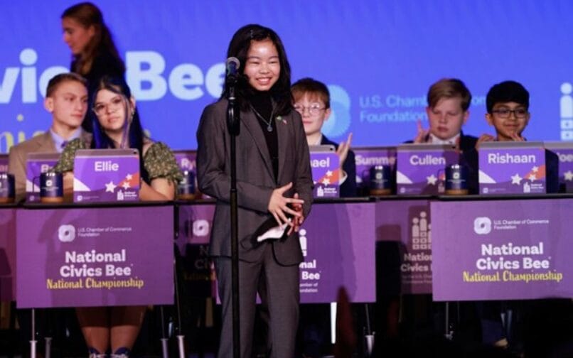 A person standing in front of a microphone