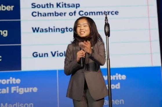 A person standing in front of a microphone