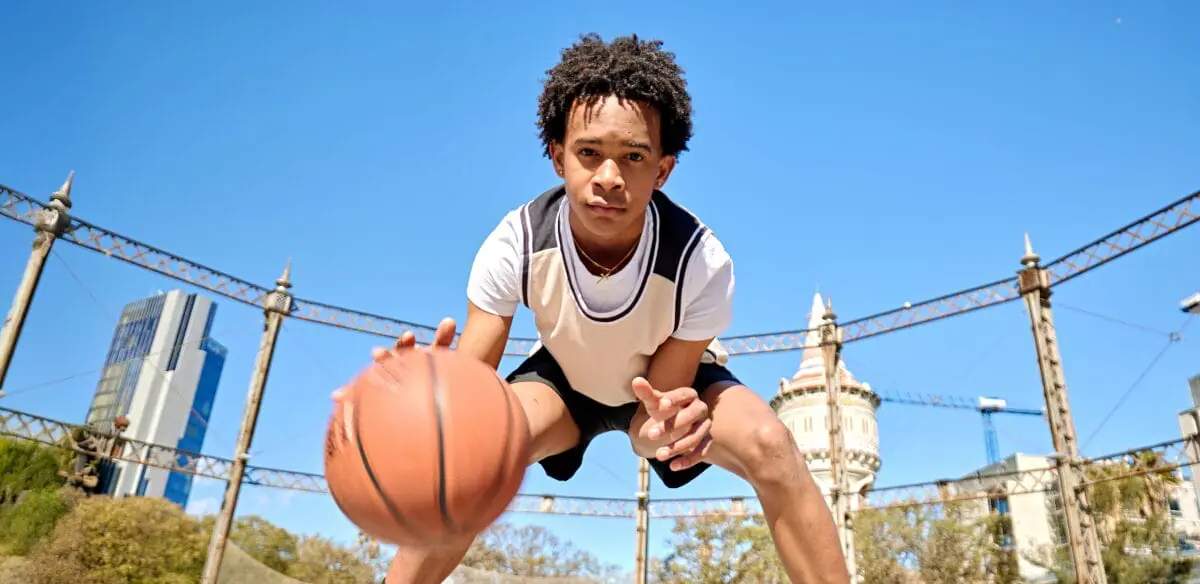 Student playing with a basket ball