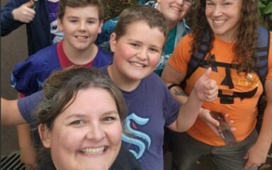 CTE teacher Felicia Kern poses for a selfie with students on a field trip